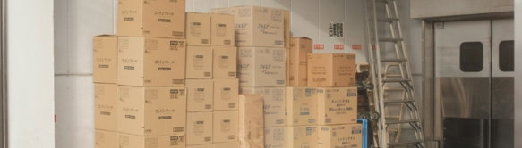 brown cardboard boxes on white floor tiles